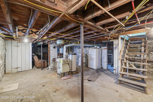 an aerial view of residential building with parking