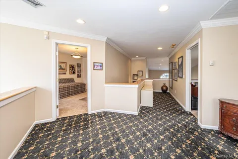 a living room with furniture window and wooden floor