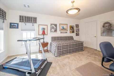 a bedroom with a bed and a desk