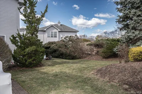 a view of a house with a yard and plants
