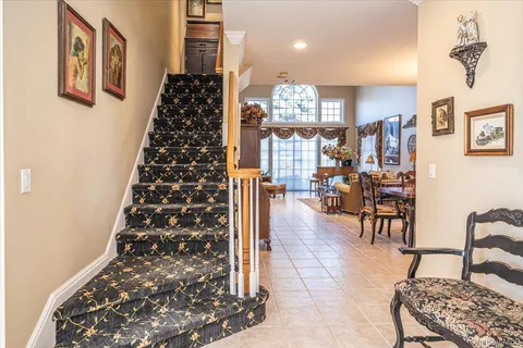 a view of an entryway with wooden floor
