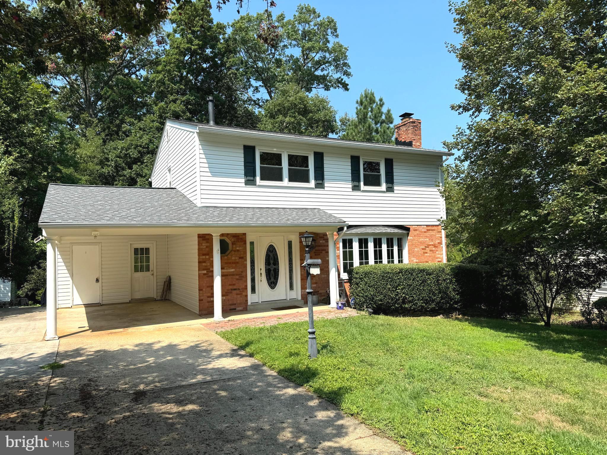 6602 Greenview Lane Springfield, VA 22152 - Photo 1 of 31 a front view of a house with a yard and garage
