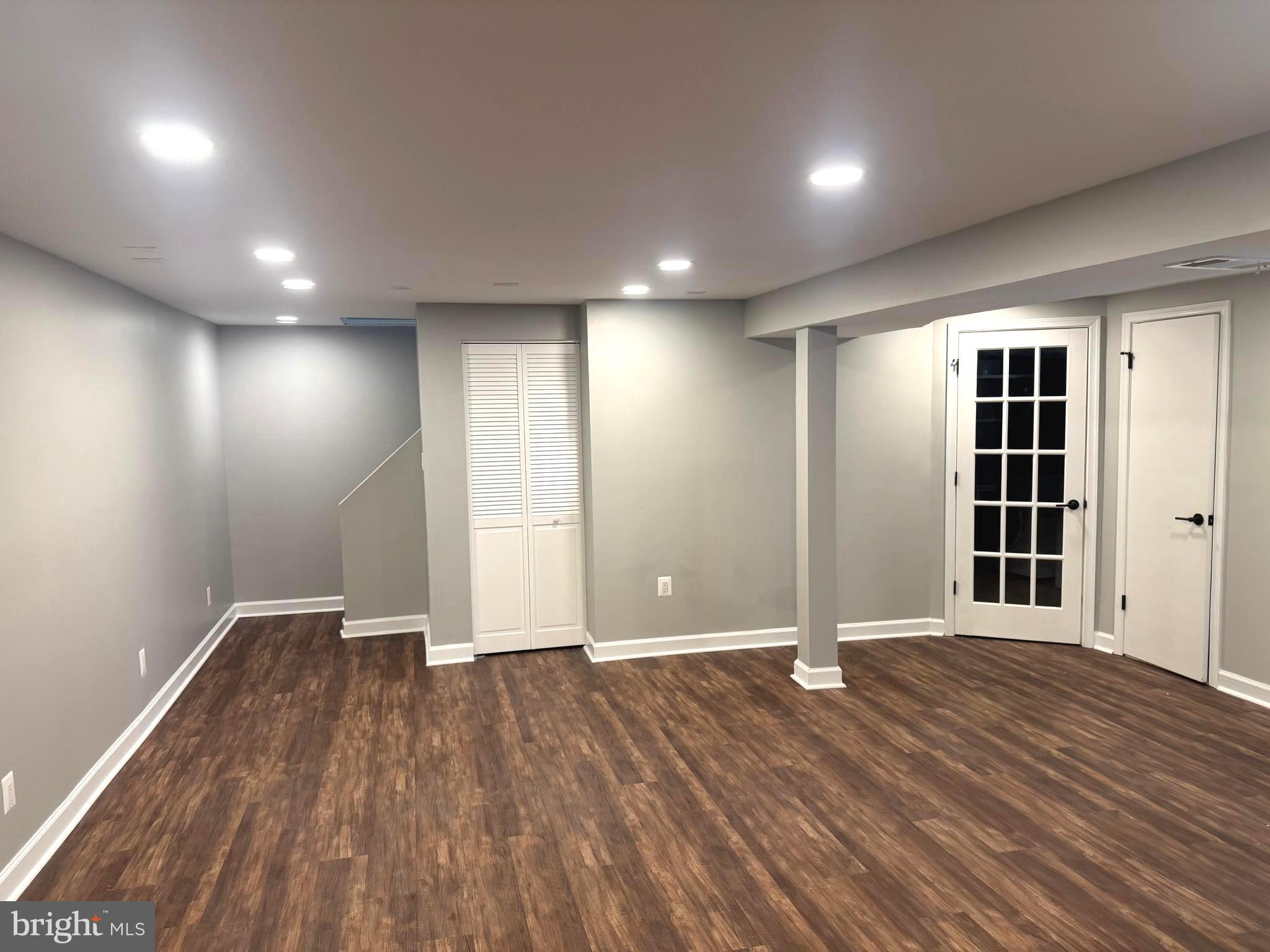6602 Greenview Lane Springfield, VA 22152 - Photo 20 of 31 an empty room with wooden floor and windows
