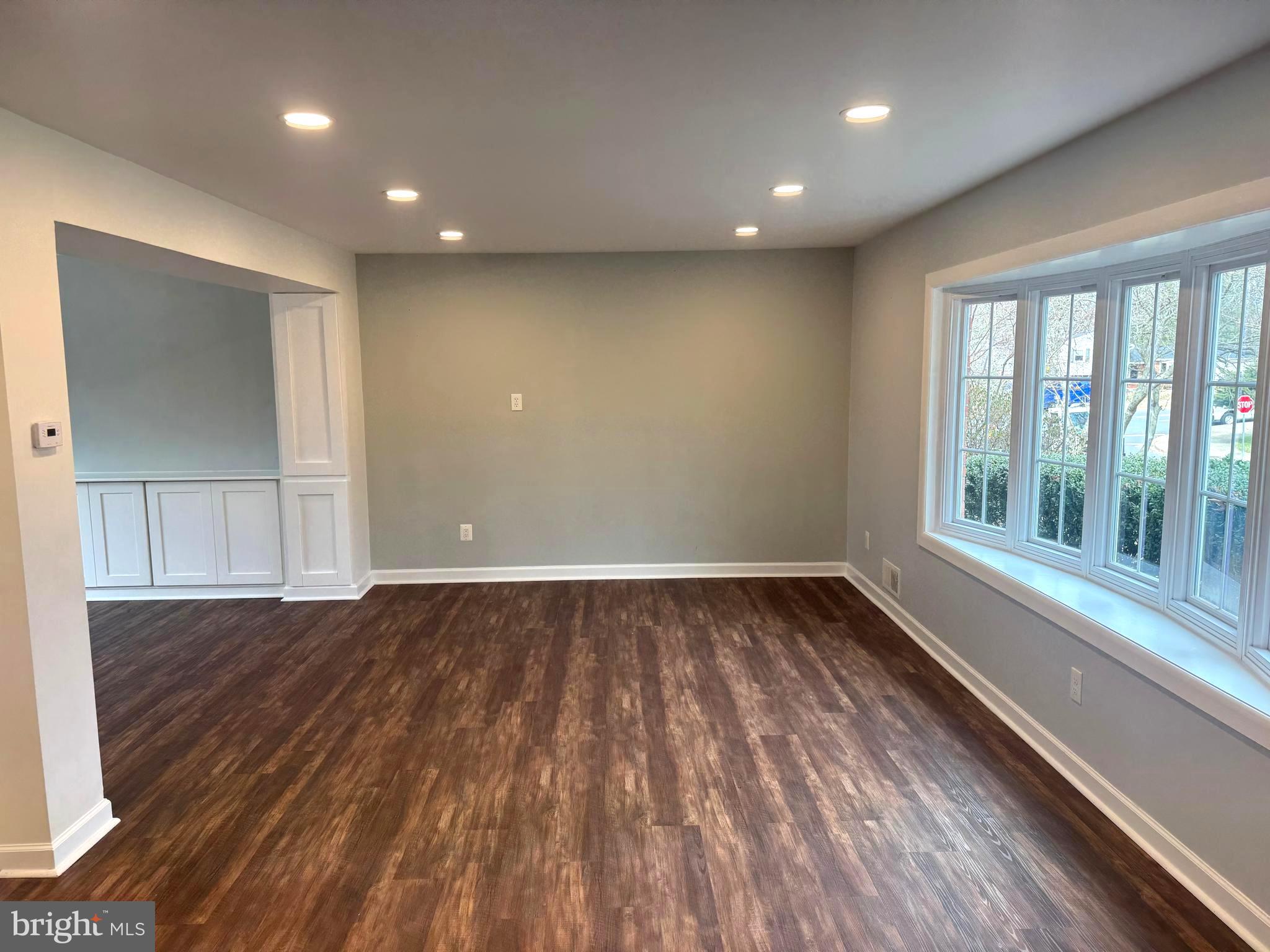 6602 Greenview Lane Springfield, VA 22152 - Photo 3 of 31 wooden floor in an empty room with a window
