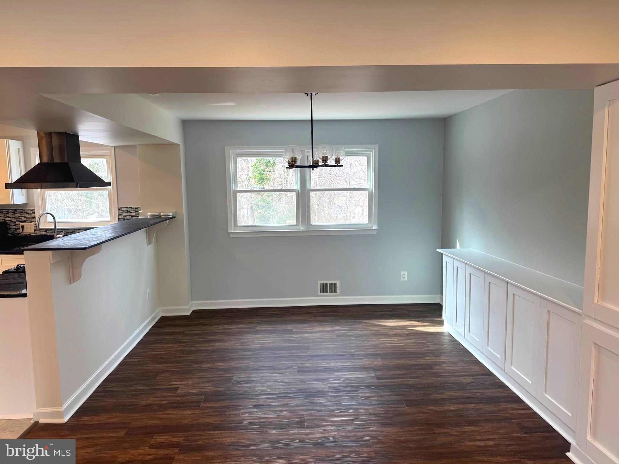 6602 Greenview Lane Springfield, VA 22152 - Photo 4 of 31 a view of an empty room with wooden floor and a window