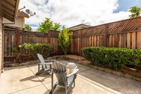 a view of a backyard with sitting area