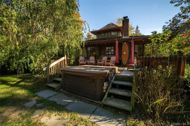 a view of a backyard with sitting area