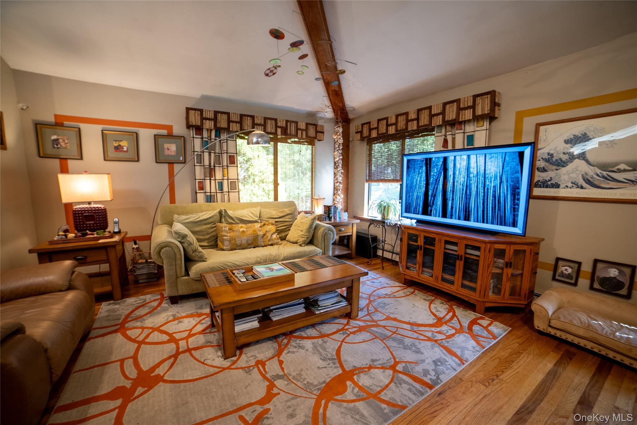 30 Long Bow Road Wading River, NY 11792 - Photo 8 of 19 a living room with furniture and a table