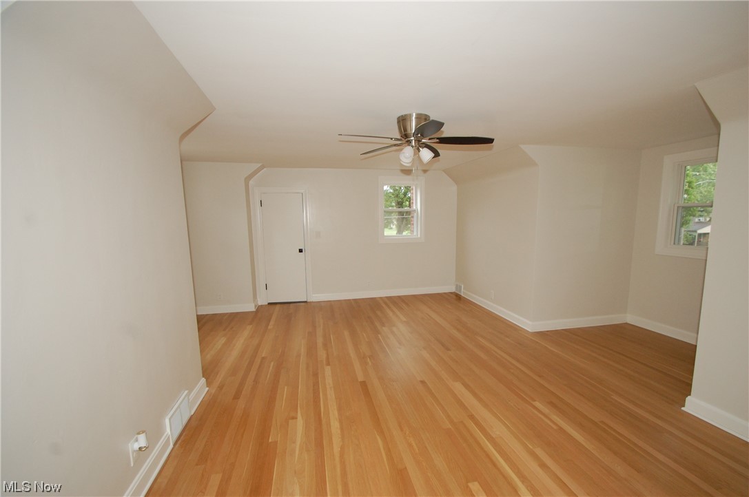 408 Ewing Road Youngstown, OH 44512 - Photo 20 of 31 Wood floored spare room featuring ceiling fan