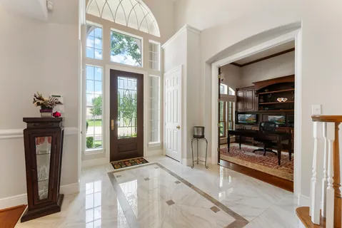 a view of an entryway with a hallway