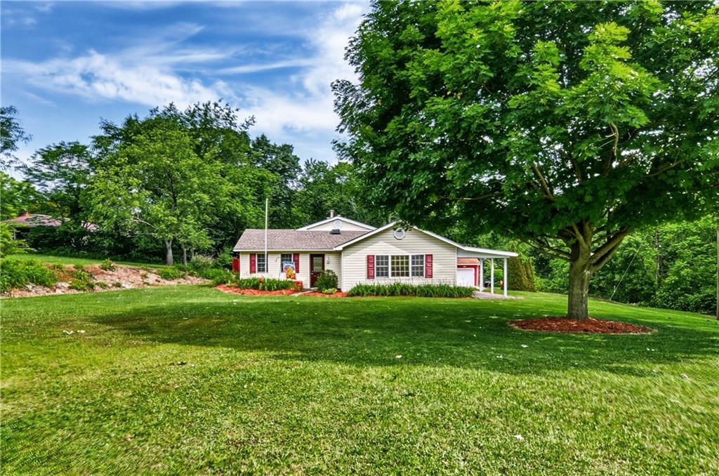 Front of house showing large lot and how it sits back off the road