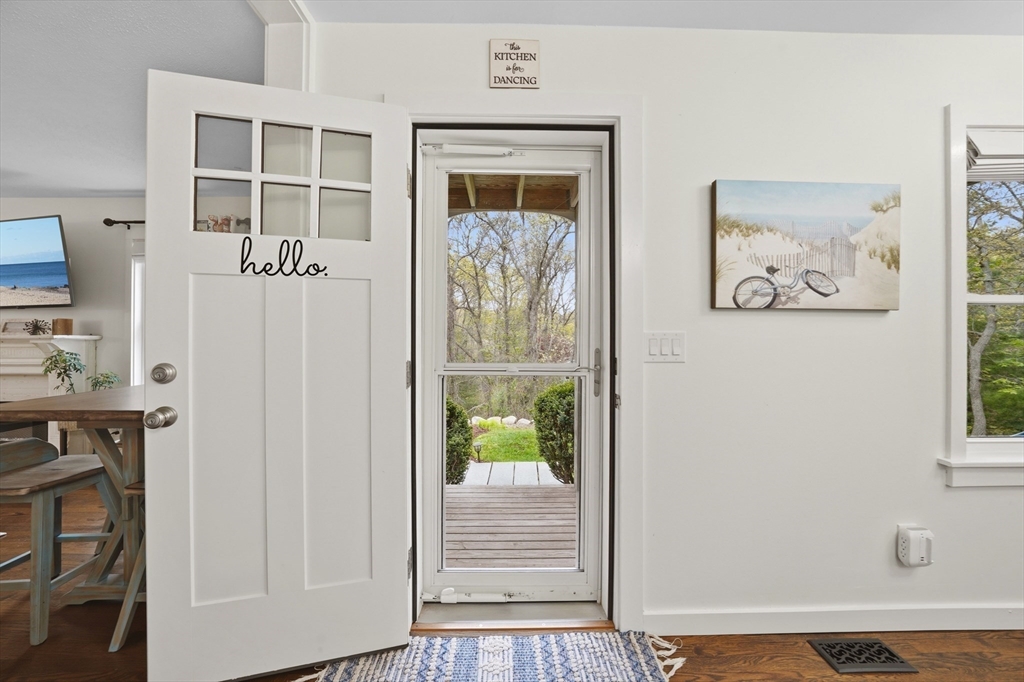 55 Ridgeview Drive Falmouth, MA 02540 - Photo 14 of 32 a view of a hallway with wooden floor and a large window