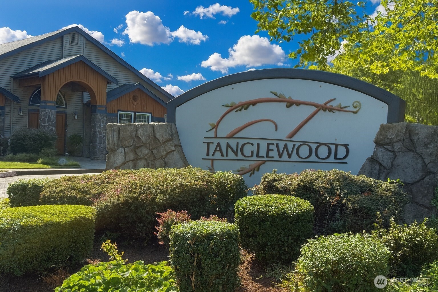 25025 Southeast Klahanie Boulevard, Unit D202 Issaquah, WA 98029 - Photo 13 of 23 a front view of a house with garden