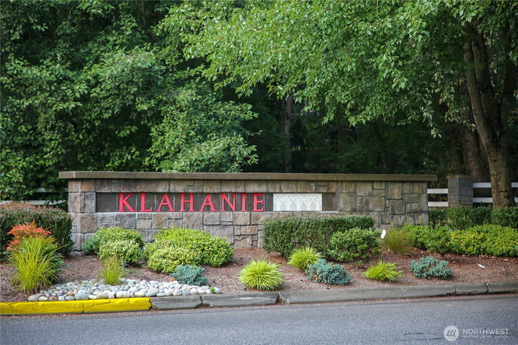 25025 Southeast Klahanie Boulevard, Unit D202 Issaquah, WA 98029 - Photo 18 of 23 a front view of a house with a yard