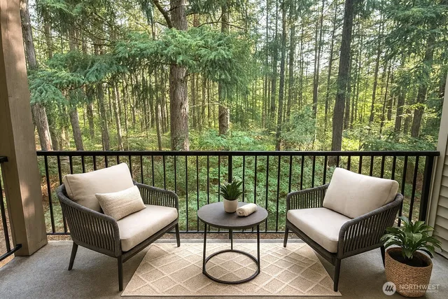a balcony with furniture and a potted plant