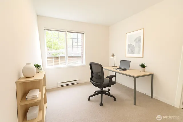 a workspace with furniture and a window