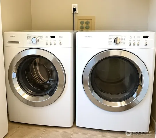 a utility room with dryer and washer