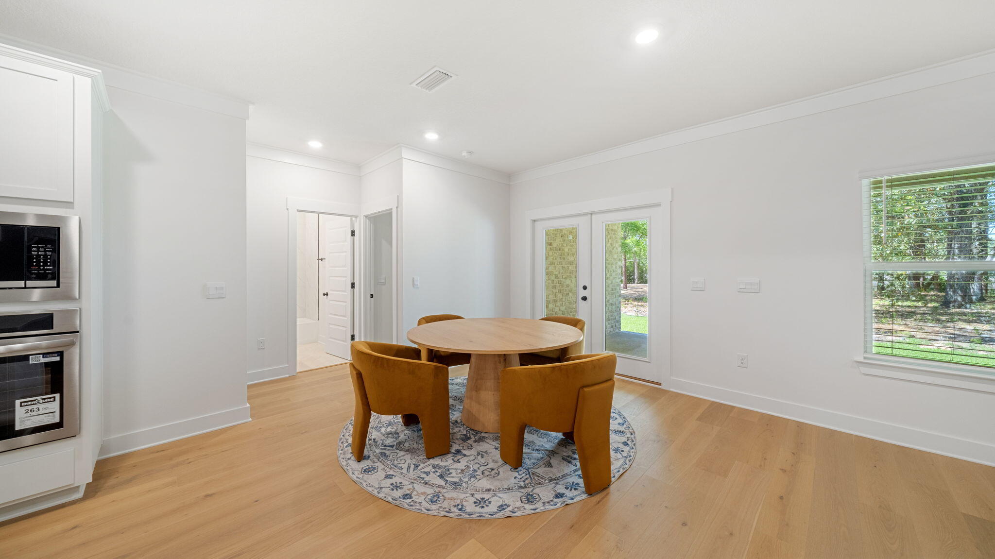 769 Old Ferry Road Santa Rosa Beach, FL 32459 - Photo 21 of 67 a view of a dining room with furniture window and wooden floor