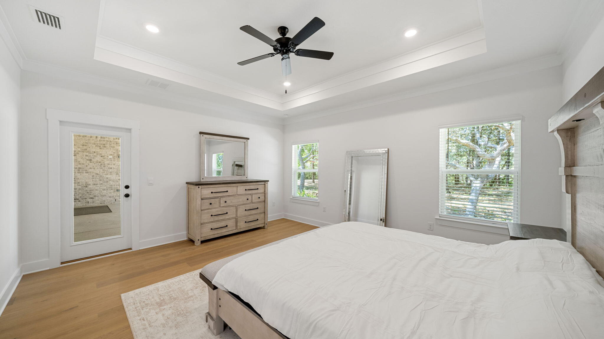 769 Old Ferry Road Santa Rosa Beach, FL 32459 - Photo 27 of 67 a bedroom with a large bed and a flat tv screen