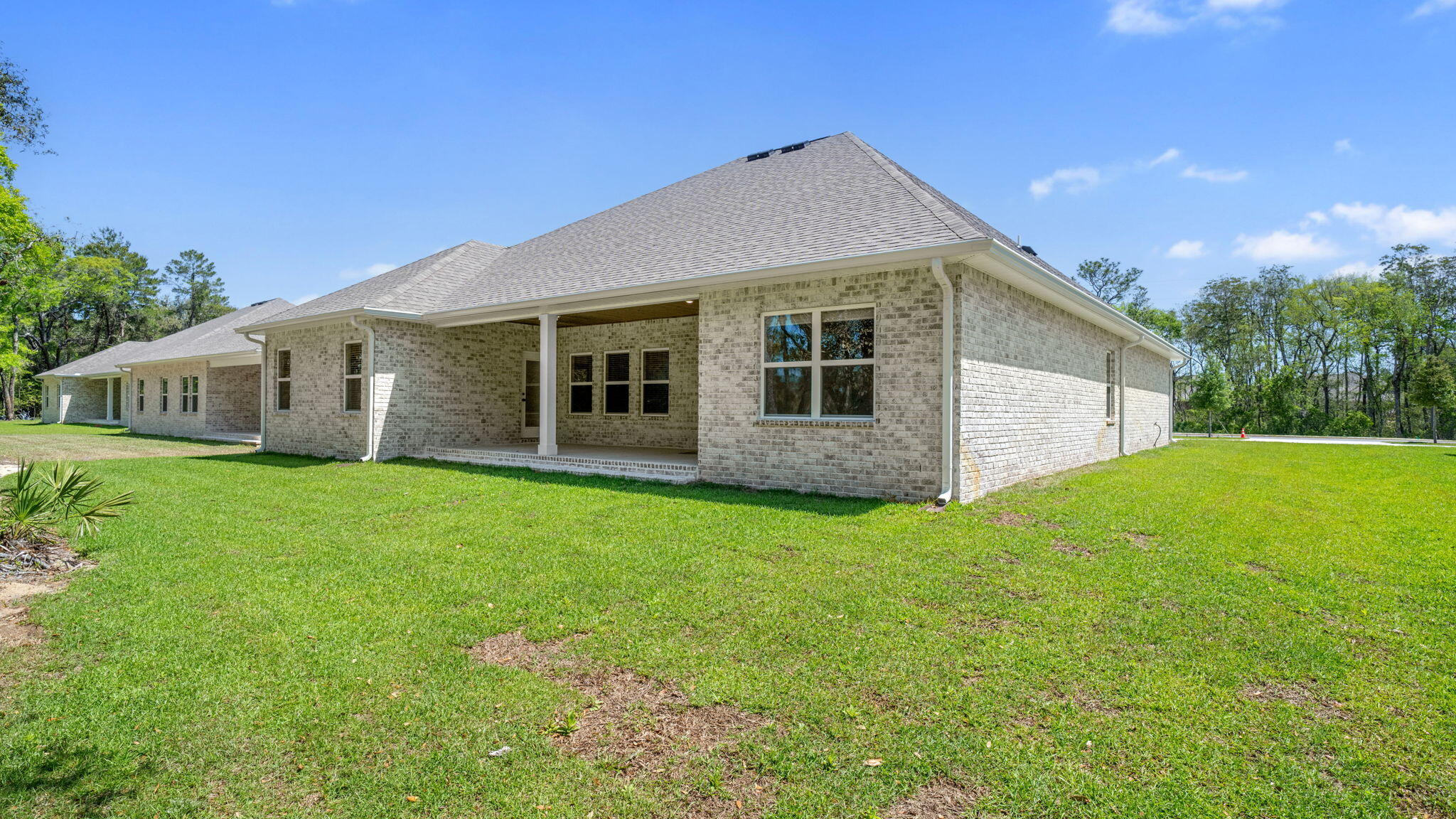 769 Old Ferry Road Santa Rosa Beach, FL 32459 - Photo 49 of 67 a view of a house with backyard and garden