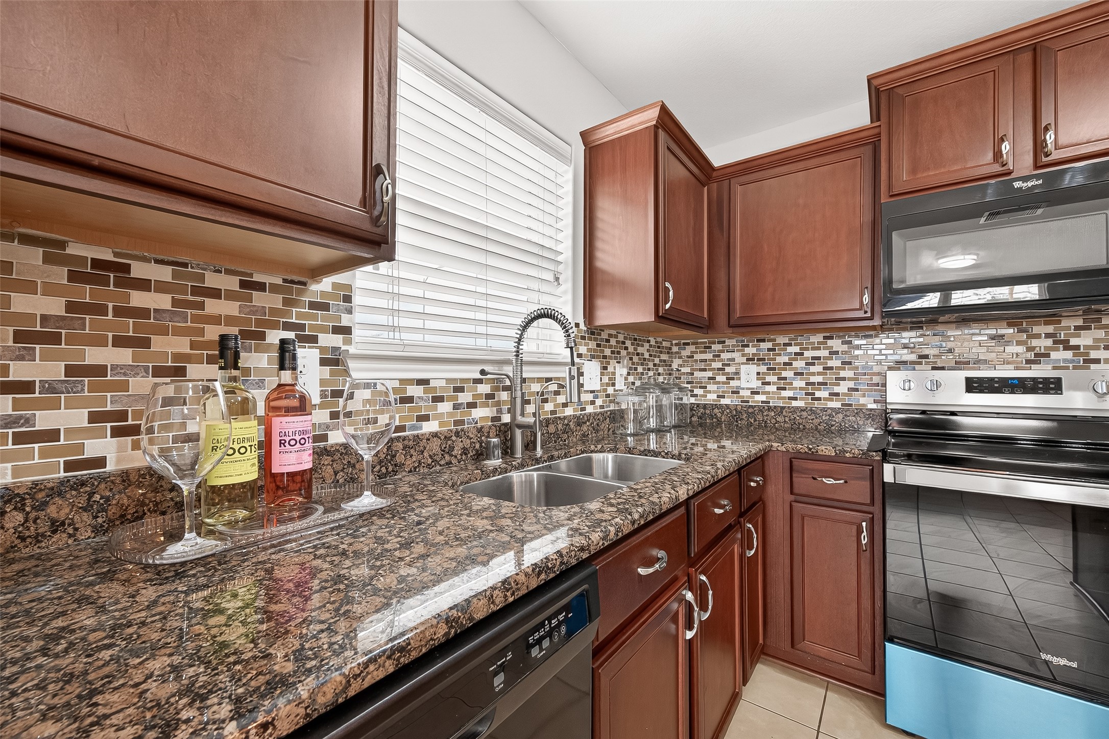 2314 Seabourne Trails Road Rosenberg, TX 77469 - Photo 13 of 38 Ample counterspace, many cabinets top & bottom. Beautiful tile backsplash.
