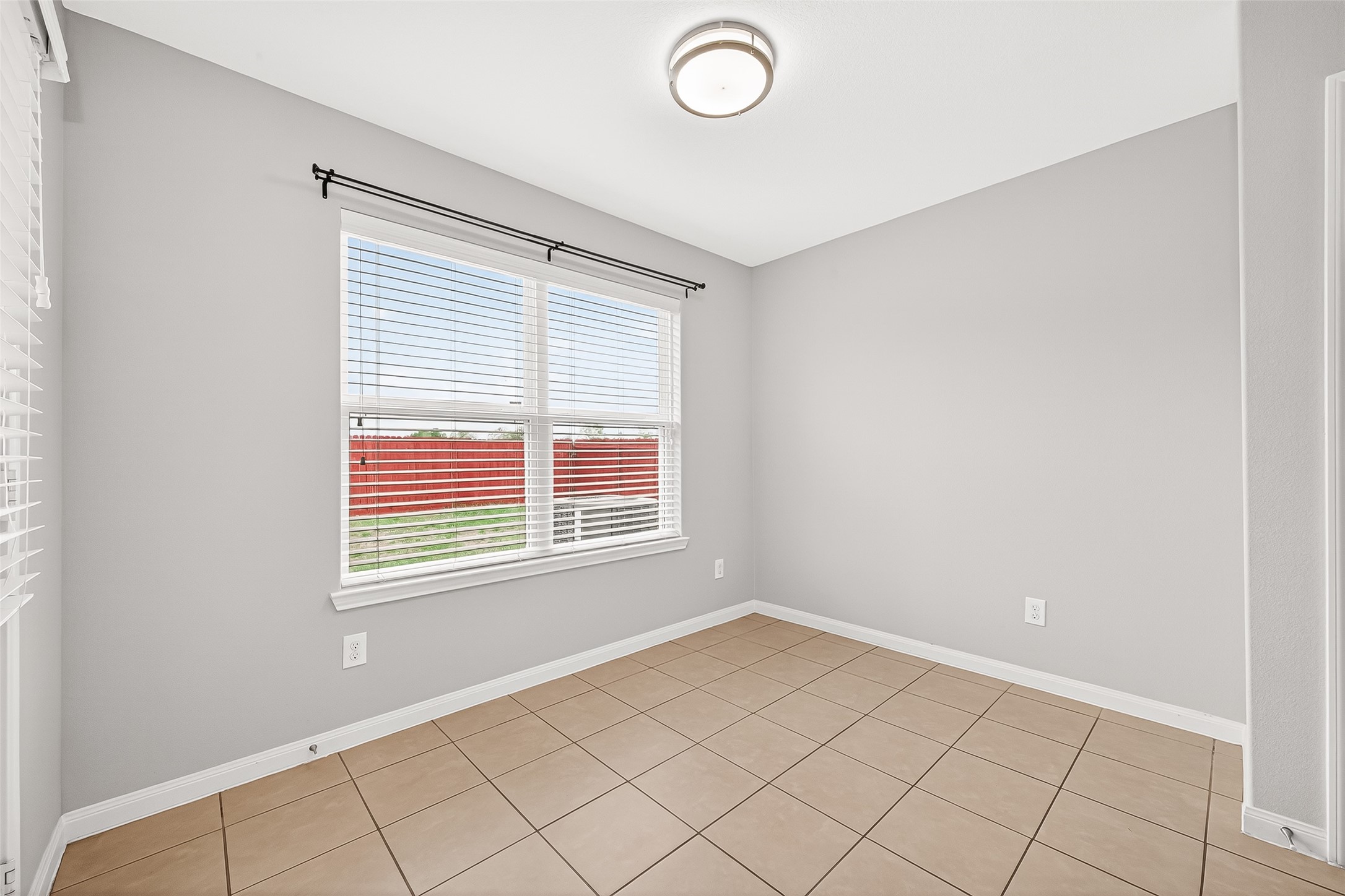 2314 Seabourne Trails Road Rosenberg, TX 77469 - Photo 15 of 38 Dining room with big window and side door to the backyard.