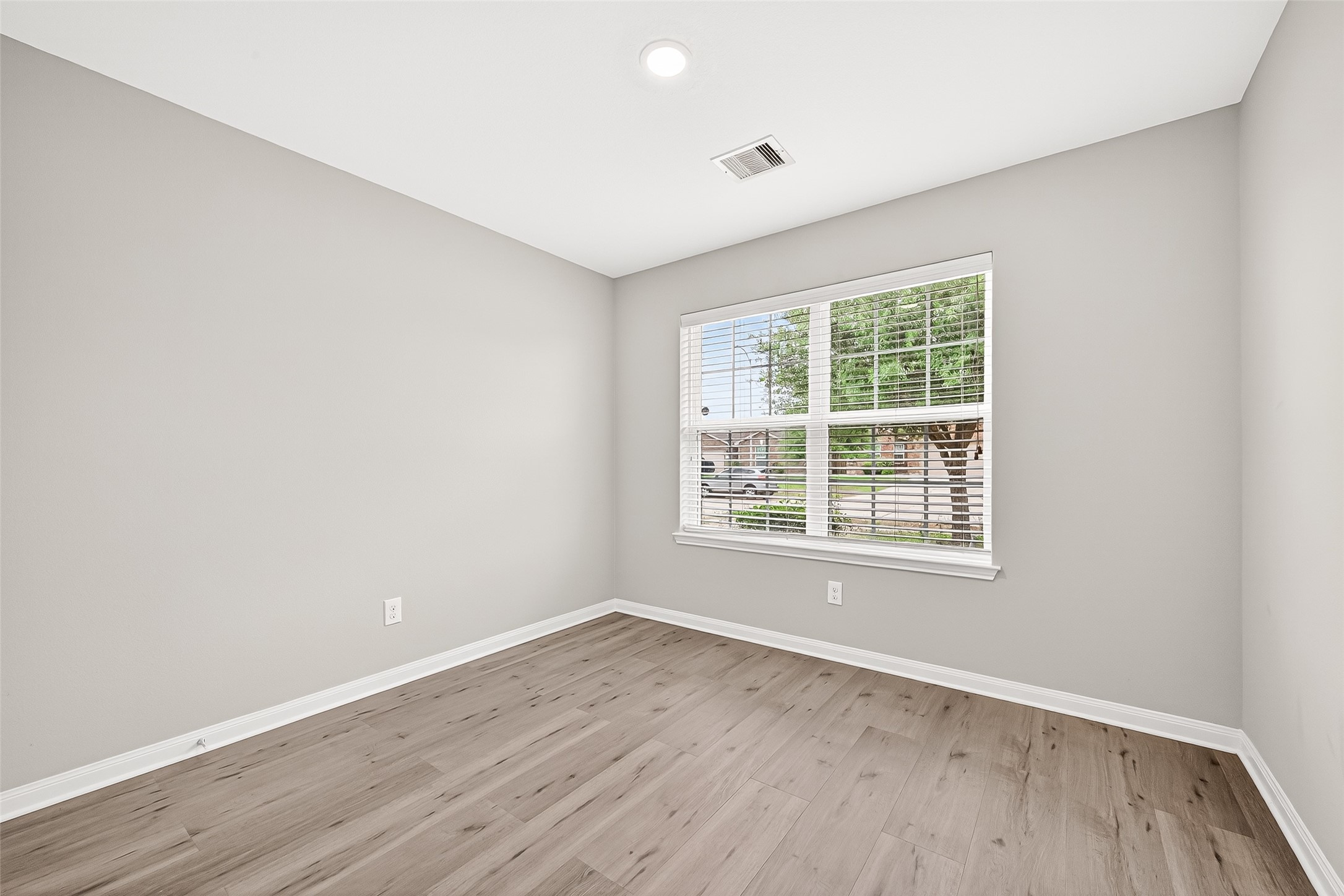 2314 Seabourne Trails Road Rosenberg, TX 77469 - Photo 18 of 38 Bedroom #2 with window facing front of the home. No carpet, WP Laminate.