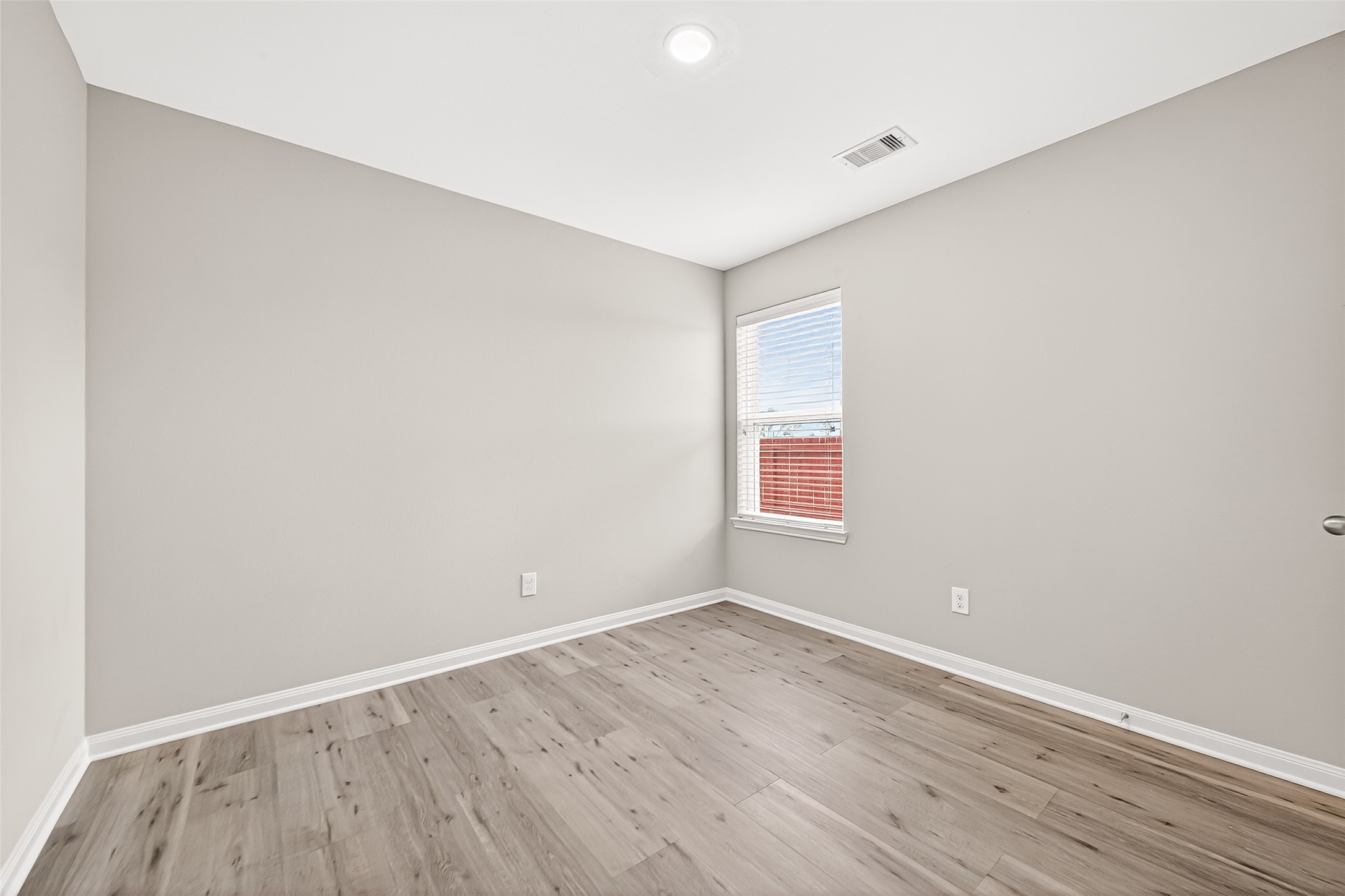 2314 Seabourne Trails Road Rosenberg, TX 77469 - Photo 22 of 38 Bedroom #3 with window facing side of the home. No carpet, WP Laminate.