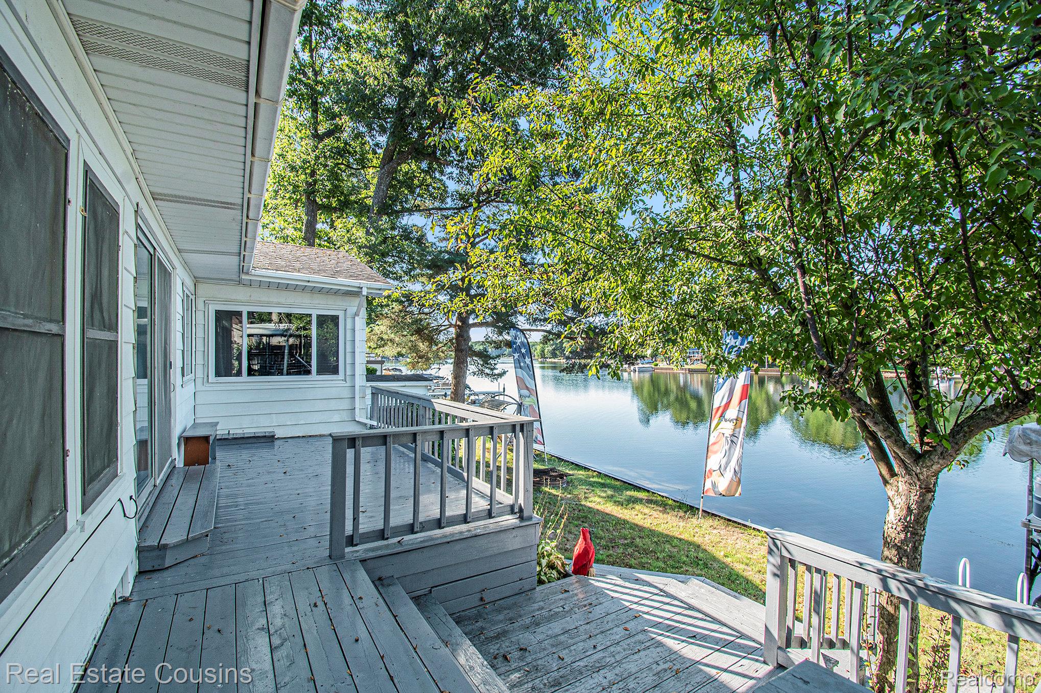 1734 Forest Road Harrison, MI 48625 - Photo 22 of 31 Wooden deck featuring a water view