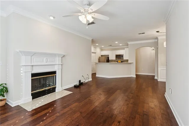 a view of a kitchen with a fireplace wooden floor and a window