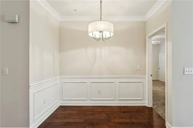 a view of wooden floor and chandelier in a room