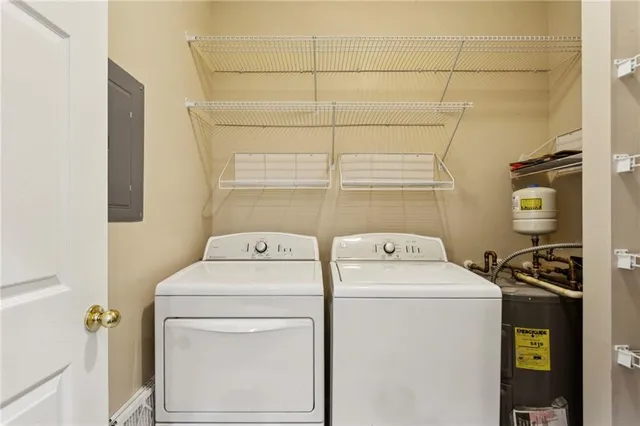 a view of a two chairs and table in the balcony