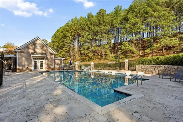 a view of a yard with plants and trees