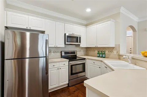 a white refrigerator freezer sitting in a kitchen