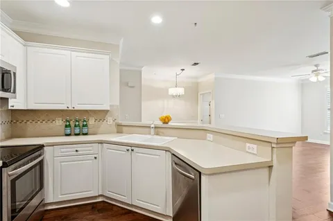 a kitchen with a sink and cabinets