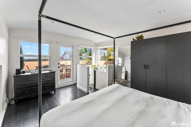 a bedroom with a bed and cabinets