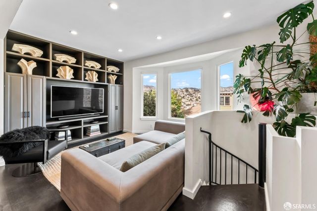 a bedroom with a bed window and a table