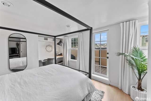 a view of a balcony with chair and table