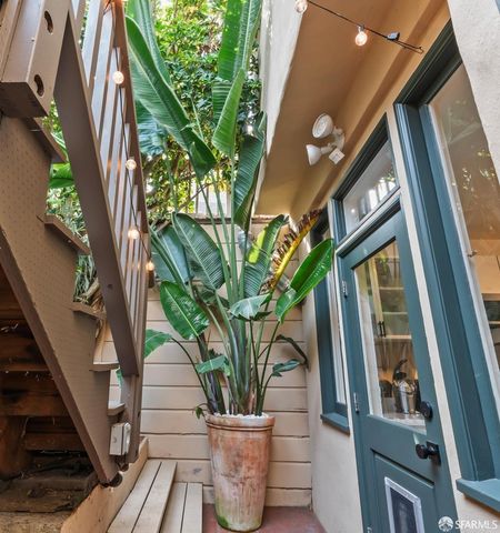 a view of a potted flower in the corridor