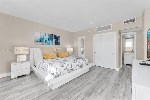 a bedroom with a bed and a couch