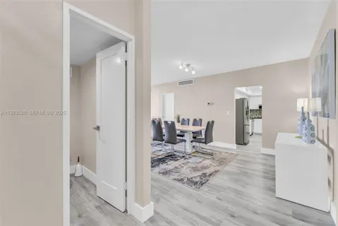 a living room with furniture a table and chair