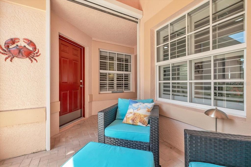 1260 Rio De Janeiro Avenue, Unit 102 Punta Gorda, FL 33983 - Photo 5 of 46 a living room with furniture and windows