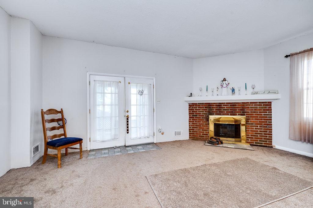 1261 Fox Run Reading, PA 19606 - Photo 19 of 46 a view of livingroom with furniture fireplace and wooden floor