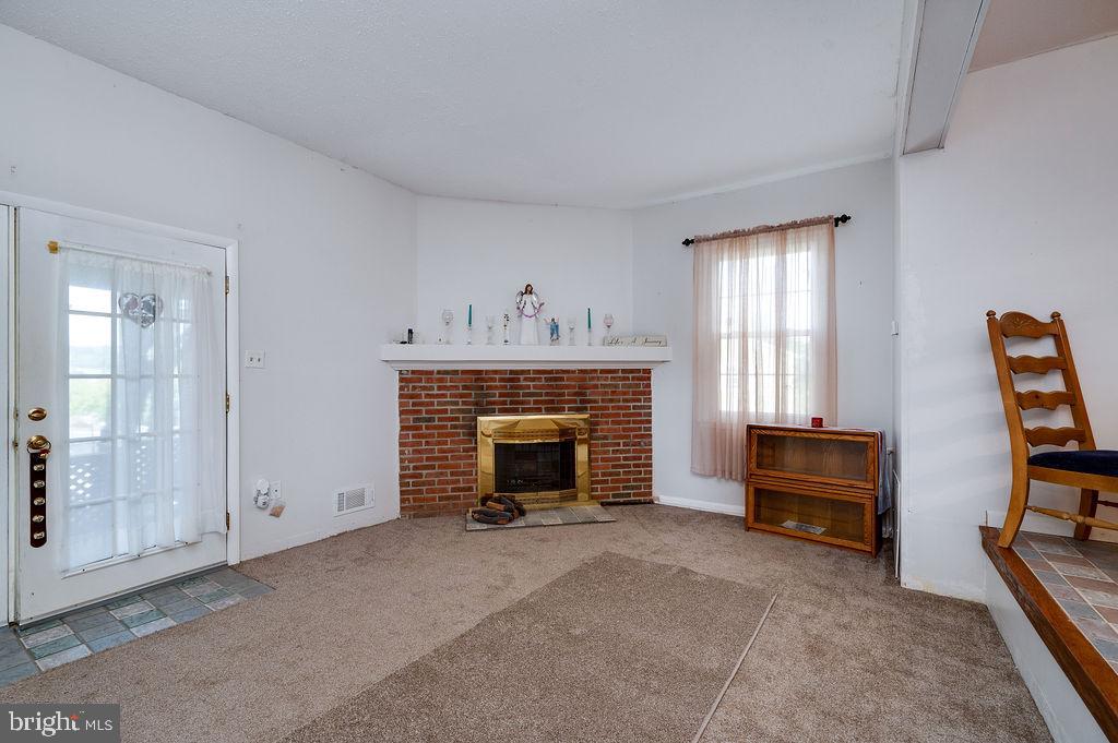 1261 Fox Run Reading, PA 19606 - Photo 20 of 46 a living room with furniture and a fireplace