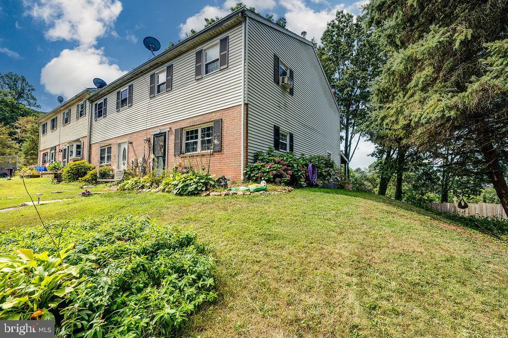 1261 Fox Run Reading, PA 19606 - Photo 2 of 46 a front view of a house with garden