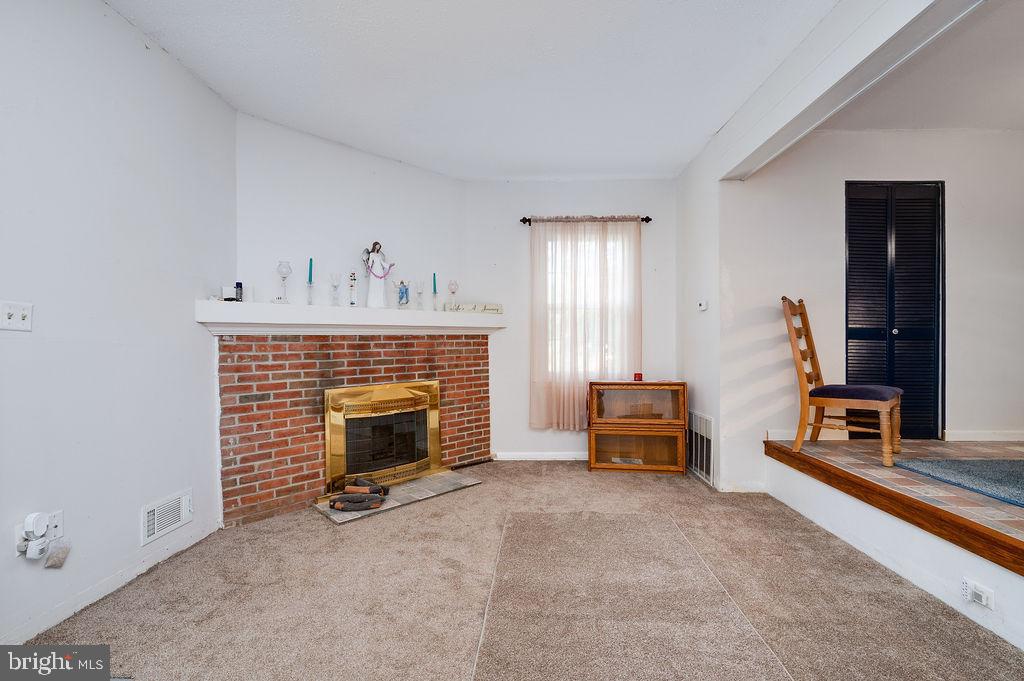 1261 Fox Run Reading, PA 19606 - Photo 21 of 46 a living room with furniture and a fireplace