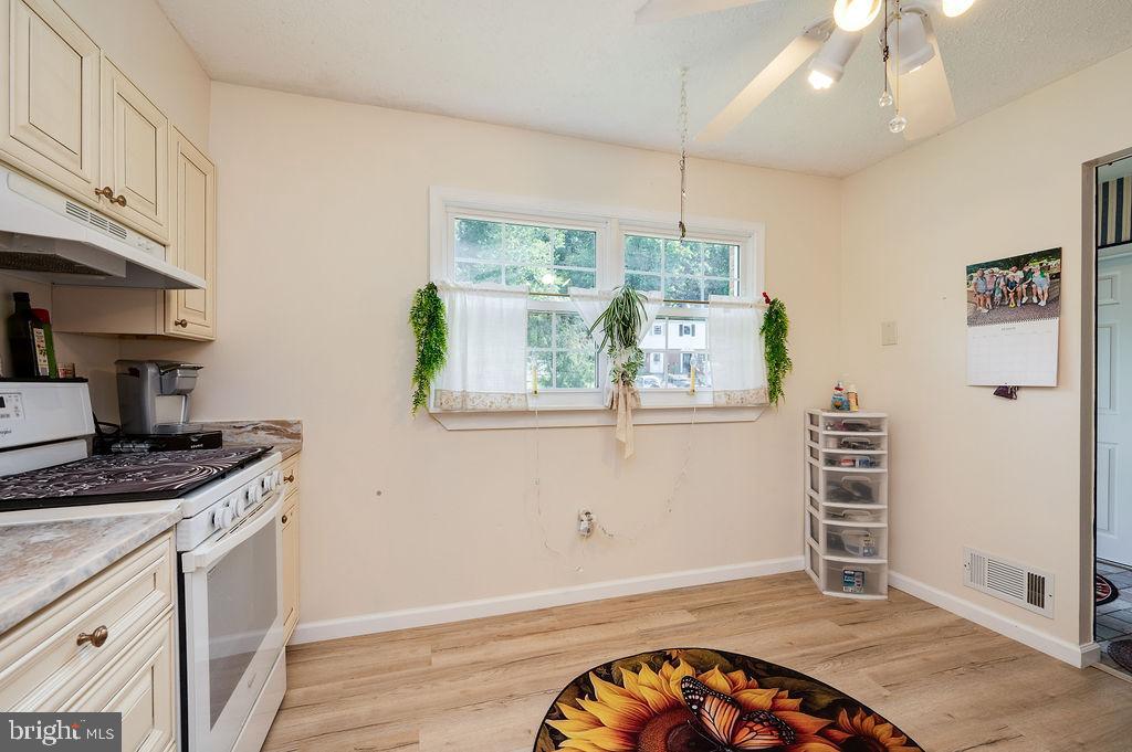 1261 Fox Run Reading, PA 19606 - Photo 9 of 46 a kitchen with a stove a sink and a window