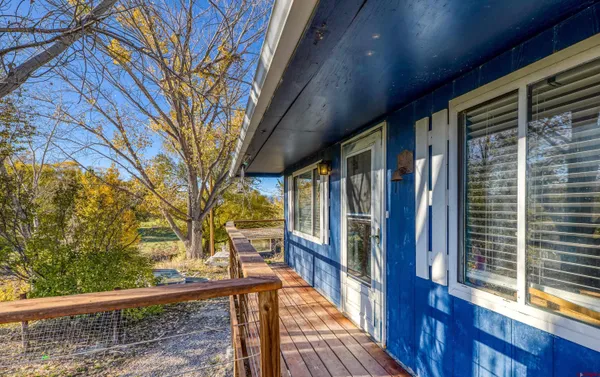 a view of a house with pool and sitting area
