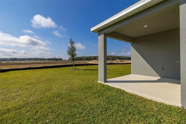 a view of an ocean pool and brick wall