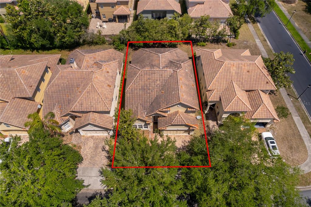 6825 Dolce Way Orlando, FL 32819 - Photo 1 of 40 an aerial view of residential house with outdoor space and swimming pool